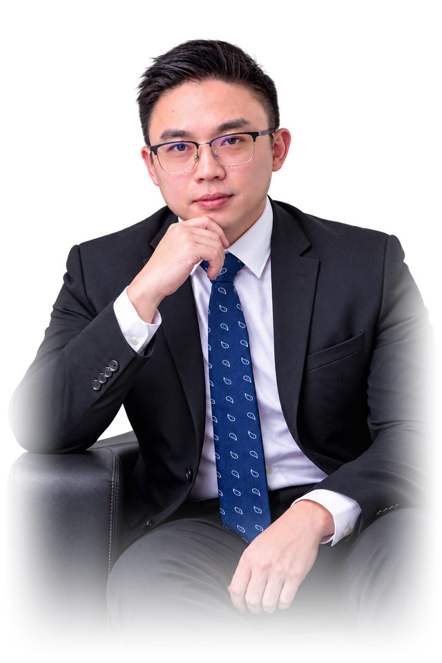 Isaac Foh, tax consultant in Melaka, seated in an armchair in a dark suit